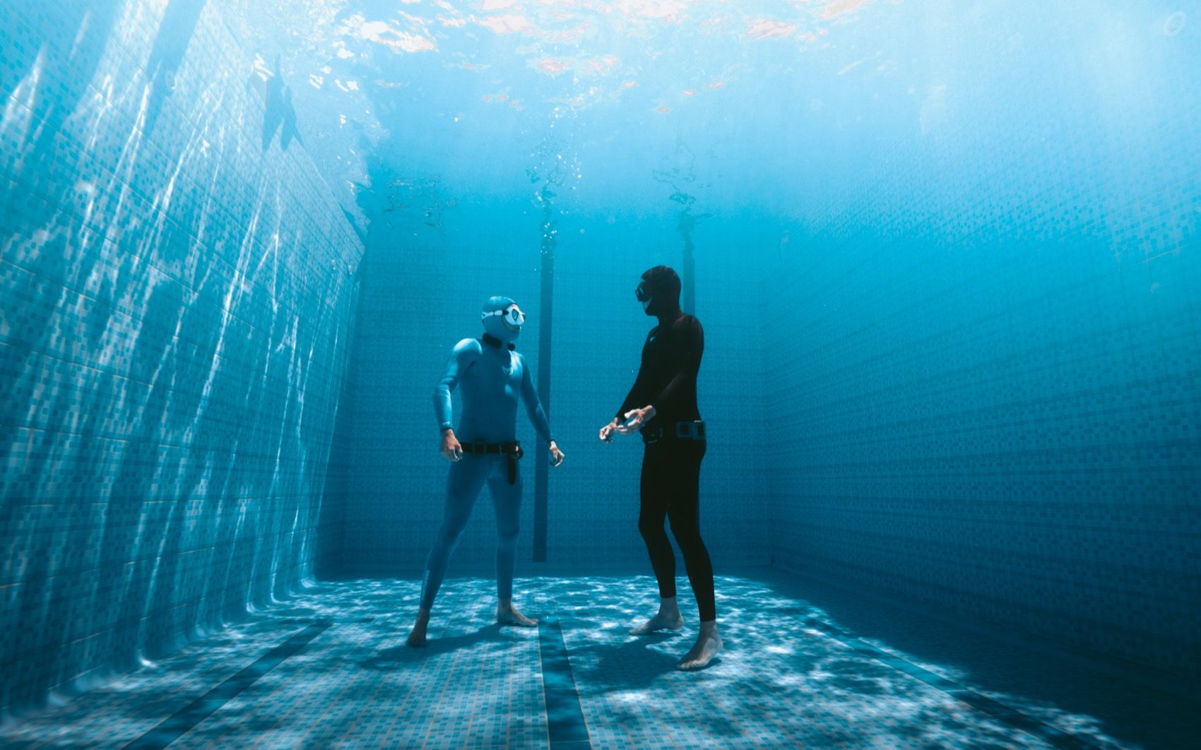 Two freedivers facing each other in the pool at The Gate Freediving